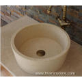 Round beige travertine sink